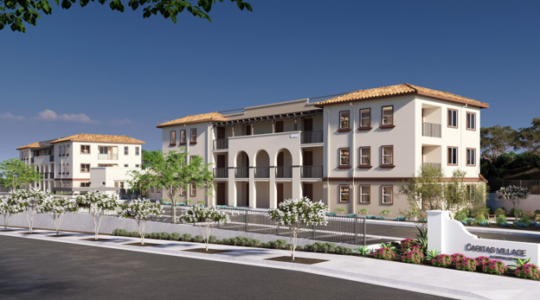Architectural rendering of Caritas Village – Vista showing two three-story apartment buildings, landscaped grounds, pedestrian walkways, and the community entrance along Plymouth Drive in Vista, California.