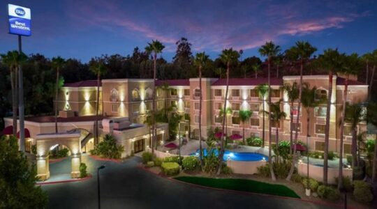 Exterior evening view of the Best Western Escondido Hotel in Escondido, California.