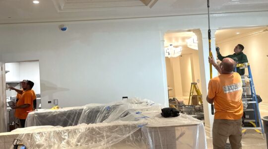 Construction workers from Level 3 Construction renovating a hotel lobby