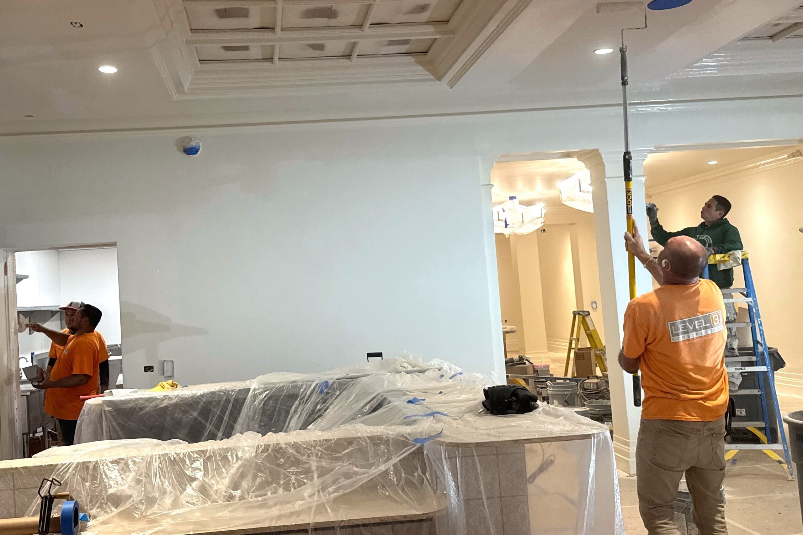 Construction workers from Level 3 Construction renovating a hotel lobby