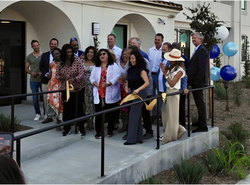 Oceanside Mayor Esther Sanchez cuts the ceremonial ribbon in front of South River Village, marking the grand opening of the city’s newest affordable housing communi