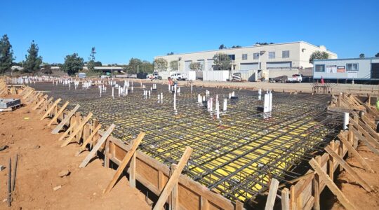 Reinforced concrete foundation with rebar grid and post-tension cables under construction at WoodSpring Suites Santee in Santee, California, by Level 3 Construction
